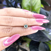 0.94 Ct. Bluish Green Sapphire from Madagascar Life Style