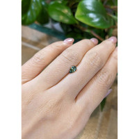 0.63 Ct. Bluish Green Sapphire from Madagascar Life Style