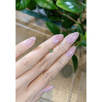 0.49 Ct. Yellowish Green Sapphire from Madagascar Life Style