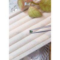 0.49 Ct. Yellowish Green Sapphire from Madagascar Life Style