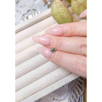 0.51 Ct. Yellowish Green Sapphire from Madagascar Life Style