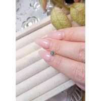 0.58 Ct. Yellowish Green Sapphire from Madagascar Life Style