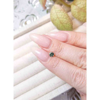 0.33 Ct. Bluish Green Sapphire from Madagascar Life Style