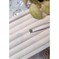 0.54 Ct. Yellowish Green Sapphire from Madagascar Life Style