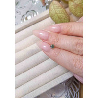 0.41 Ct. Yellowish Green Sapphire from Madagascar Life Style