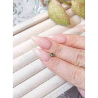 0.31 Ct. Bluish Green Sapphire from Madagascar Life Style