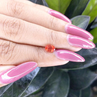 0.82 Ct. Reddish Orange Sapphire from Ceylon (Sri Lanka) Life Style