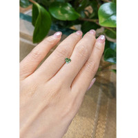 0.58 Ct. Yellowish Green Sapphire from Madagascar Life Style