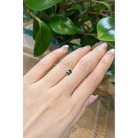 0.62 Ct. Bluish Green Sapphire from Madagascar Life Style