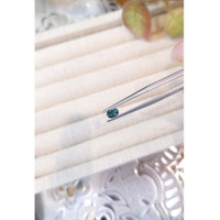 0.45 Ct. Bluish Green Sapphire from Madagascar Life Style