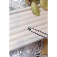 0.49 Ct. Bluish Green Sapphire from Madagascar Life Style