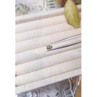 0.60 Ct. Yellowish Green Sapphire from Madagascar Life Style