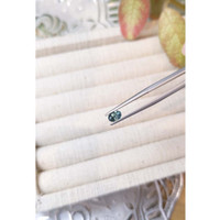 0.62 Ct. Bluish Green Sapphire from Madagascar Life Style