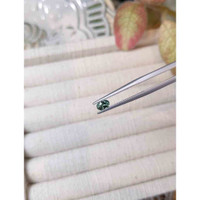 0.57 Ct. Bluish Green Sapphire from Madagascar Life Style