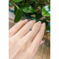 0.38 Ct. Greenish Blue Sapphire from Madagascar Life Style