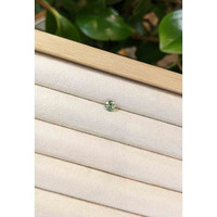 0.71 Ct. Bluish Green Sapphire from Madagascar Life Style