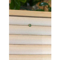 0.53 Ct. Yellowish Green Sapphire from Madagascar Life Style