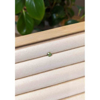 0.42 Ct. Yellowish Green Sapphire from Madagascar Life Style