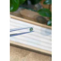 0.45 Ct. Bluish Green Sapphire from Madagascar Life Style