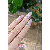 0.45 Ct. Bluish Green Sapphire from Madagascar Life Style