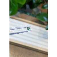 0.57 Ct. Yellowish Green Sapphire from Madagascar Life Style