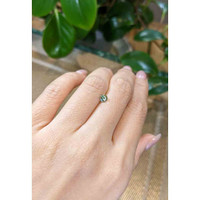 0.57 Ct. Yellowish Green Sapphire from Madagascar Life Style