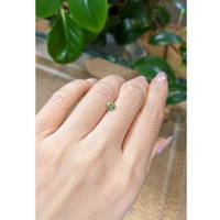 0.67 Ct. Yellowish Green Sapphire from Madagascar Life Style