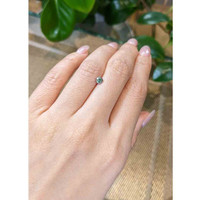 0.41 Ct. Bluish Green Sapphire from Madagascar Life Style