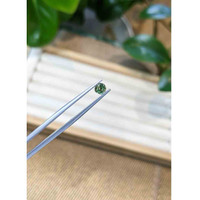 0.56 Ct. Bluish Green Sapphire from Madagascar Life Style