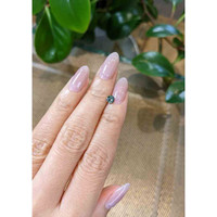 0.55 Ct. Greenish Brown Sapphire from Madagascar Life Style