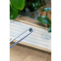 0.55 Ct. Greenish Brown Sapphire from Madagascar Life Style