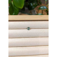 0.45 Ct. Greenish Blue Sapphire from Madagascar Life Style