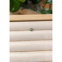 0.47 Ct. Yellowish Green Sapphire from Madagascar Life Style