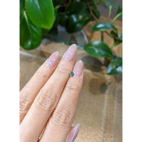 0.37 Ct. Bluish Green Sapphire from Madagascar Life Style