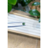0.53 Ct. Bluish Green Sapphire from Madagascar Life Style