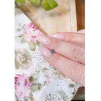 0.64 Ct. Greenish Blue Sapphire from Madagascar Life Style