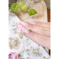 0.60 Ct. Yellowish Green Sapphire from Madagascar Life Style