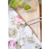 0.60 Ct. Yellowish Green Sapphire from Madagascar Life Style