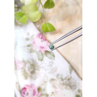 0.46 Ct. Bluish Green Sapphire from Madagascar Life Style