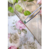 0.49 Ct. Yellowish Green Sapphire from Madagascar Life Style