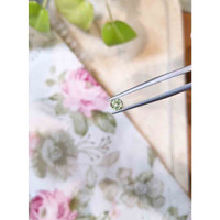 0.47 Ct. Yellowish Green Sapphire from Madagascar Life Style