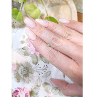 0.35 Ct. Yellowish Green Sapphire from Madagascar Life Style