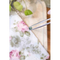 0.55 Ct. Bluish Green Sapphire from Madagascar Life Style