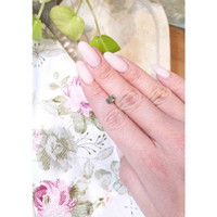 0.88 Ct. Yellowish Green Sapphire from Madagascar Life Style