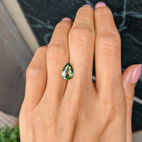 2.61 Ct. Yellowish Green Sapphire from Madagascar Life Style