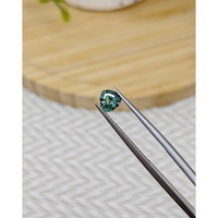 0.89 Ct. Bluish Green Sapphire from Madagascar Life Style