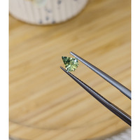 0.66 Ct. Yellowish Green Sapphire from Madagascar Life Style