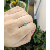 0.72 Ct. Yellowish Green Sapphire from Madagascar Life Style