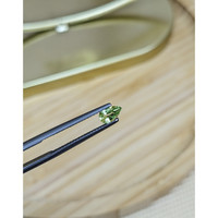 0.52 Ct. Yellowish Green Sapphire from Madagascar Life Style