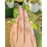 0.52 Ct. Yellowish Green Sapphire from Madagascar Life Style